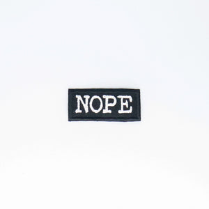 NerdyKeppie's "NOPE" Embroidered Patch are stitched on sturdy rectangular duck cloth and backed with vinyl fuse.