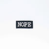 NerdyKeppie's "NOPE" Embroidered Patch are stitched on sturdy rectangular duck cloth and backed with vinyl fuse.