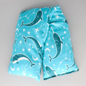 A NerdyKeppie Narwhals in Space Flannel Heat & Cold Pack. A microwaveable heat and cold pack featuring a narwhal-themed design, great gift for friends with, you know, achy joints and stuff.