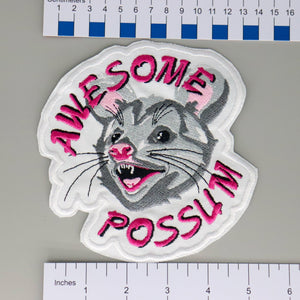 NerdyKeppie's No Hooked Backing "Awesome Possum" Embroidered Patch are stitched on black duck cloth and backed by sturdy vinyl fuse.