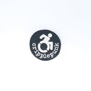 NerdyKeppie's No Hooked Backing "Cripplepunk" Embroidered Disability Pride Patch are stitched on black duck cloth and backed by sturdy vinyl fuse.