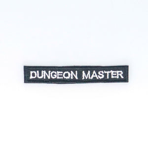 NerdyKeppie's No Hooked Backing "Dungeon Master" Embroidered Patch are stitched on sturdy rectangular duck cloth and backed with vinyl fuse.