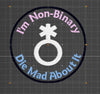 NerdyKeppie's No Hooked Backing "I'm Non-Binary Die Mad About It" Embroidered Trans Pride Patch are stitched on black duck cloth and backed by sturdy vinyl fuse.