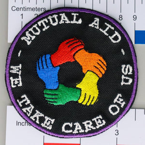 NerdyKeppie's No Hooked Backing "Mutual Aid" Embroidered Rainbow Gay Pride Patches are stitched on black duck cloth and backed by sturdy vinyl fuse.