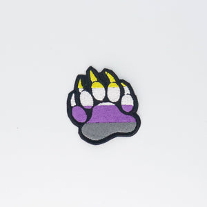 NerdyKeppie's Non-Binary Bear Paw Embroidered Pride Patch are shaped like their namesake and stitched on black duck cloth!