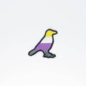 NerdyKeppie's Non-Binary Crow Embroidered Pride Patch are shaped like their namesake and stitched on black duck cloth!