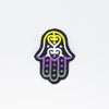 NerdyKeppie's Non-Binary Hamsa Embroidered Pride Patch are stitched on black duck cloth and backed by sturdy vinyl fuse.