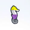 NerdyKeppie's Non-Binary Seahorse Embroidered Pride Patch are shaped like their namesake and stitched on black duck cloth!