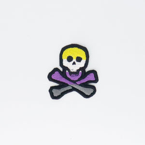 NerdyKeppie's Non-Binary Skull And Crossbones Embroidered Pride Patch are stitched on black duck cloth and backed by sturdy vinyl fuse.