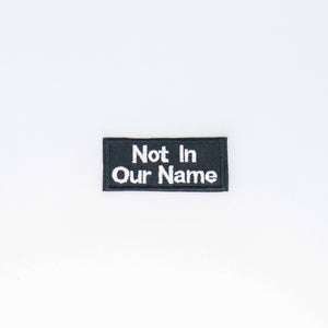 NerdyKeppie's "Not In Our Name" Embroidered Patch are stitched on sturdy rectangular duck cloth and backed with vinyl fuse.