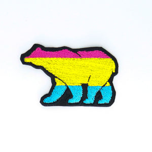 NerdyKeppie's Pan Bear Embroidered Pride Patch are shaped like their namesake and stitched on black duck cloth!