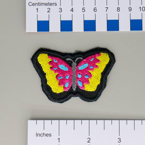 NerdyKeppie's Pan Psychedelic Butterfly Embroidered Pride Patch are shaped like their namesake and stitched on black duck cloth!