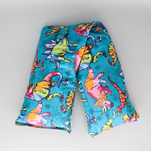 A NerdyKeppie Pastel Dinosaurs Probably Didn't Exist Heat & Cold Packs. A microwaveable heat and cold pack featuring a dino-themed design, great gift for people who want dinosaurs that look rad and don't care about accuracy.