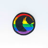 NerdyKeppie's Phoenix Embroidered Pride Patch are shaped like their namesake and stitched on black duck cloth!