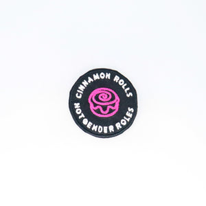 NerdyKeppie's Pink "Cinnamon Rolls, Not Gender Roles" Embroidered Patch are stitched on black duck cloth and backed by sturdy vinyl fuse.