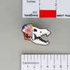 NerdyKeppie Proud to the Bone Dire Wolf Skull Pride Enamel Pins. A Dire Wolf skull pride enamel pin for our Proud to the Bone project. This prehistoric pin is wearing an adorable crown of flowers!