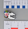 NerdyKeppie Proud to the Bone Cave Bear Skull Pride Enamel Pins. A cave bear skull pride enamel pin for our Proud to the Bone project. This prehistoric pin wears an adorable flower crown & makes a perfect nerd gift!