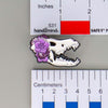 NerdyKeppie Proud to the Bone Dire Wolf Skull Pride Enamel Pins. A Dire Wolf skull pride enamel pin for our Proud to the Bone project. This prehistoric pin is wearing an adorable crown of flowers!