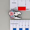 NerdyKeppie Proud to the Bone Dire Wolf Skull Pride Enamel Pins. A Dire Wolf skull pride enamel pin for our Proud to the Bone project. This prehistoric pin is wearing an adorable crown of flowers!
