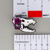 NerdyKeppie Proud to the Bone Dire Wolf Skull Pride Enamel Pins. A Dire Wolf skull pride enamel pin for our Proud to the Bone project. This prehistoric pin is wearing an adorable crown of flowers!