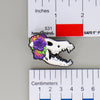 NerdyKeppie Proud to the Bone Dire Wolf Skull Pride Enamel Pins. A Dire Wolf skull pride enamel pin for our Proud to the Bone project. This prehistoric pin is wearing an adorable crown of flowers!