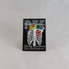 NerdyKeppie Proud to the Bone Human Ribcage Pride Enamel Pins. A human ribcage pride enamel pin for our Proud to the Bone project, wearing an adorable crown of flowers!