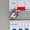 NerdyKeppie Proud to the Bone Parasauralophus Skull Pride Enamel Pins. A Parasauralophus skull pride enamel pin for our Proud to the Bone project. This prehistoric pin is wearing an adorable crown of flowers!