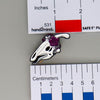 NerdyKeppie Proud to the Bone Parasauralophus Skull Pride Enamel Pins. A Parasauralophus skull pride enamel pin for our Proud to the Bone project. This prehistoric pin is wearing an adorable crown of flowers!