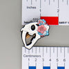 NerdyKeppie Proud to the Bone Sabertooth Tiger Skull Pride Enamel Pins. A Sabertooth Tiger skull pride enamel pin for our Proud to the Bone project, a perfect prehistoric gift for your favorite nerd. This prehistoric pin wears an adorable flower crown!