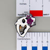 NerdyKeppie Proud to the Bone Sabertooth Tiger Skull Pride Enamel Pins. A Sabertooth Tiger skull pride enamel pin for our Proud to the Bone project, a perfect prehistoric gift for your favorite nerd. This prehistoric pin wears an adorable flower crown!