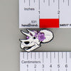 NerdyKeppie Proud to the Bone Triceratops Skull Pride Enamel Pins. A Triceratops skull pride enamel pin for our Proud to the Bone project. This prehistoric pin is wearing an adorable crown of flowers!