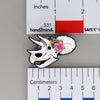 NerdyKeppie Proud to the Bone Triceratops Skull Pride Enamel Pins. A Triceratops skull pride enamel pin for our Proud to the Bone project. This prehistoric pin is wearing an adorable crown of flowers!