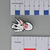 NerdyKeppie Proud to the Bone Triceratops Skull Pride Enamel Pins. A Triceratops skull pride enamel pin for our Proud to the Bone project. This prehistoric pin is wearing an adorable crown of flowers!