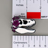 NerdyKeppie Proud to the Bone Tyrannosaurus Rex Skull Pride Enamel Pins. A Tyrannosaurus Rex skull pride enamel pin for our Proud to the Bone project. This prehistoric T-Rex pin is wearing an adorable crown of flowers!