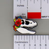 NerdyKeppie Proud to the Bone Tyrannosaurus Rex Skull Pride Enamel Pins. A Tyrannosaurus Rex skull pride enamel pin for our Proud to the Bone project. This prehistoric T-Rex pin is wearing an adorable crown of flowers!