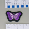 NerdyKeppie's Psychedelic Butterfly Embroidered Pride Patch are shaped like their namesake and stitched on black duck cloth!