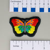 NerdyKeppie's Psychedelic Butterfly Embroidered Pride Patch are shaped like their namesake and stitched on black duck cloth!