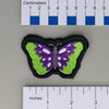 NerdyKeppie's Psychedelic Butterfly Embroidered Pride Patch are shaped like their namesake and stitched on black duck cloth!