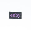 NerdyKeppie's Purple "Enby" Embroidered Non-Binary Pride Patch are stitched on sturdy rectangular duck cloth and backed with vinyl fuse.