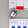 NerdyKeppie Proud to the Bone Parasauralophus Skull Pride Enamel Pins. A Parasauralophus skull pride enamel pin for our Proud to the Bone project. This prehistoric pin is wearing an adorable crown of flowers!