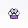 NerdyKeppie's Queer (Purple) Dog Paw Embroidered Pride Patch are shaped like their namesake and stitched on black duck cloth!