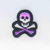 NerdyKeppie's Queer (Purple) Skull And Crossbones Embroidered Pride Patch are stitched on black duck cloth and backed by sturdy vinyl fuse.