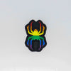 NerdyKeppie's Rainbow BONEYARD Spider Embroidered Pride Patch are shaped like their namesake and stitched on black duck cloth!