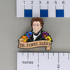 NerdyKeppie Dr. James Barry Historically Queer Enamel Pride Pin. Our NerdyKeppie Historically Queer Pride enamel pin features Dr. James Barry surrounded by flowers in your choice of transgender, gay men's / MLM, or rainbow gay pride colors. This pride pin ships from Portland, Oregon.