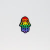 NerdyKeppie's Rainbow Hamsa Embroidered Pride Patch are stitched on black duck cloth and backed by sturdy vinyl fuse.