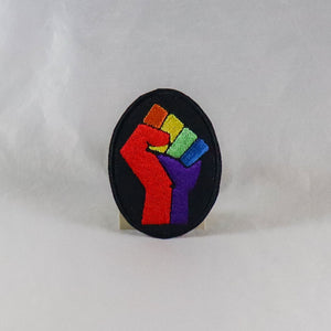 NerdyKeppie's Rainbow Raised Fist Embroidered Rainbow Gay Pride Patch are stitched on black duck cloth and backed by sturdy vinyl fuse.