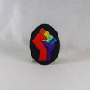 NerdyKeppie's Rainbow Raised Fist Embroidered Rainbow Gay Pride Patch are stitched on black duck cloth and backed by sturdy vinyl fuse.