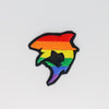 NerdyKeppie's Rainbow Shark Embroidered Pride Patch are shaped like their namesake and stitched on black duck cloth!