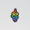 NerdyKeppie's Rainbow Snake Embroidered Pride Patch are shaped like their namesake and stitched on black duck cloth!