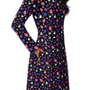 A person wearing a NerdyKeppie Raveyard Ghosts Genderfluid Pride Long Sleeve Midi Dress With Pockets. 